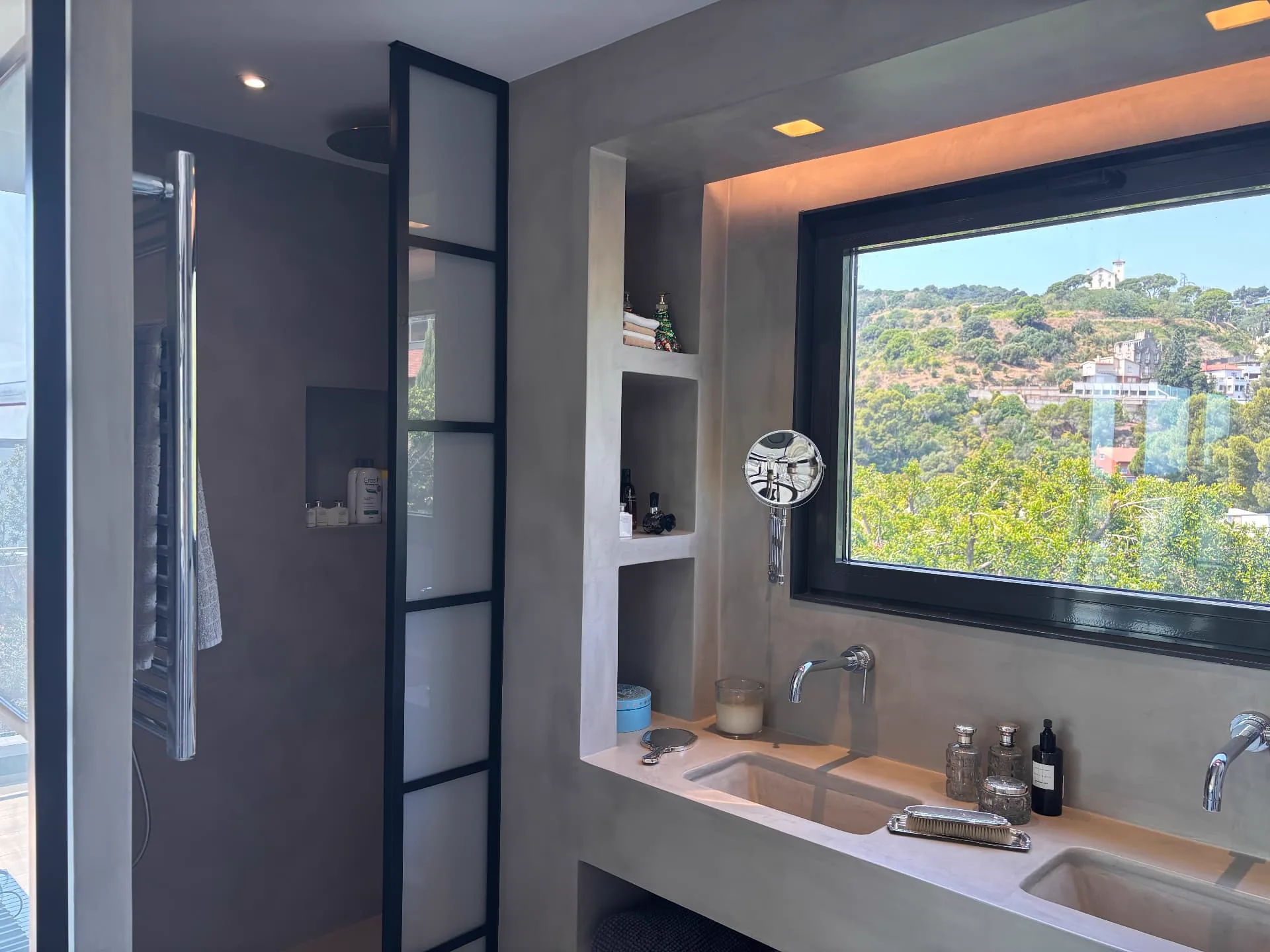 Upstairs bathroom with microcement, black-framed glazing and integrated storage — Christina’s Home