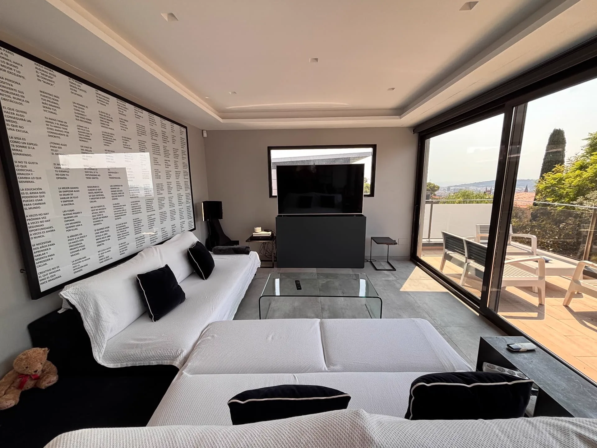Summer TV room with cotton sofa covers and a custom typographic mural designed by Christina — Christina’s Home
